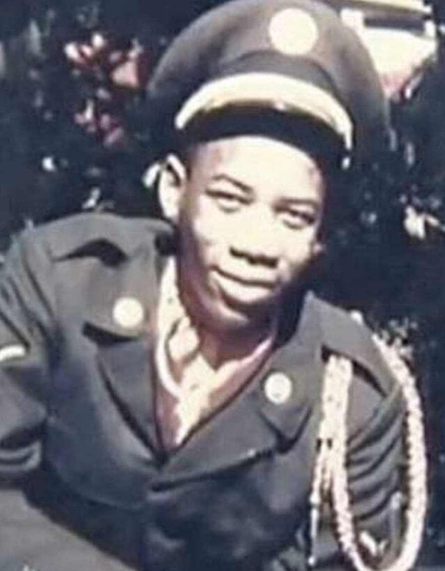 An airman poses in uniform.