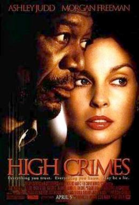 A movie poster for "High Crimes," showing a man and a woman.