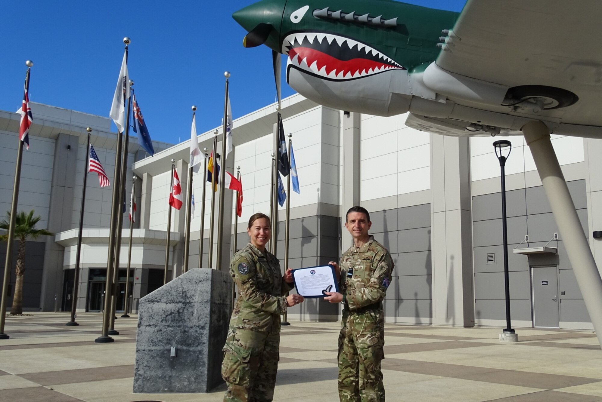 Royal Air Force Air Vice-Marshal Paul Godfrey (right), UK Space Command commander, presents U.S. Space Force Lt. Col. Michaela Schannep (left), Director of Operations for the 55th Combat Training Squadron, with a UK Space Operations Badge in recognition of Schannep’s status as a UK-qualified space instructor.
(U.S. Space Force photo by Capt. Jefferson Mitchell)