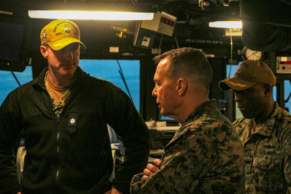 Cmdr. Colin Roberts, commanding officer, USS Ralph Johnson (DDG 114) briefs Maj. Gen. Jay Bargeron, commanding general, 3d Marine Division, and Capt. Walt Mainor, deputy commodore, Destroyer Squadron (DESRON) 15, in the ship’s pilothouse. Ralph Johnson is supporting U.S. Marines and members of the Japan Ground Self-Defense Force (JGSDF) as part of Resolute Dragon, an exercise designed to strengthen the defensive capabilities of the U.S.-Japan Alliance by refining procedures for bilateral command, control, and coordination in a geographically distributed environment.
