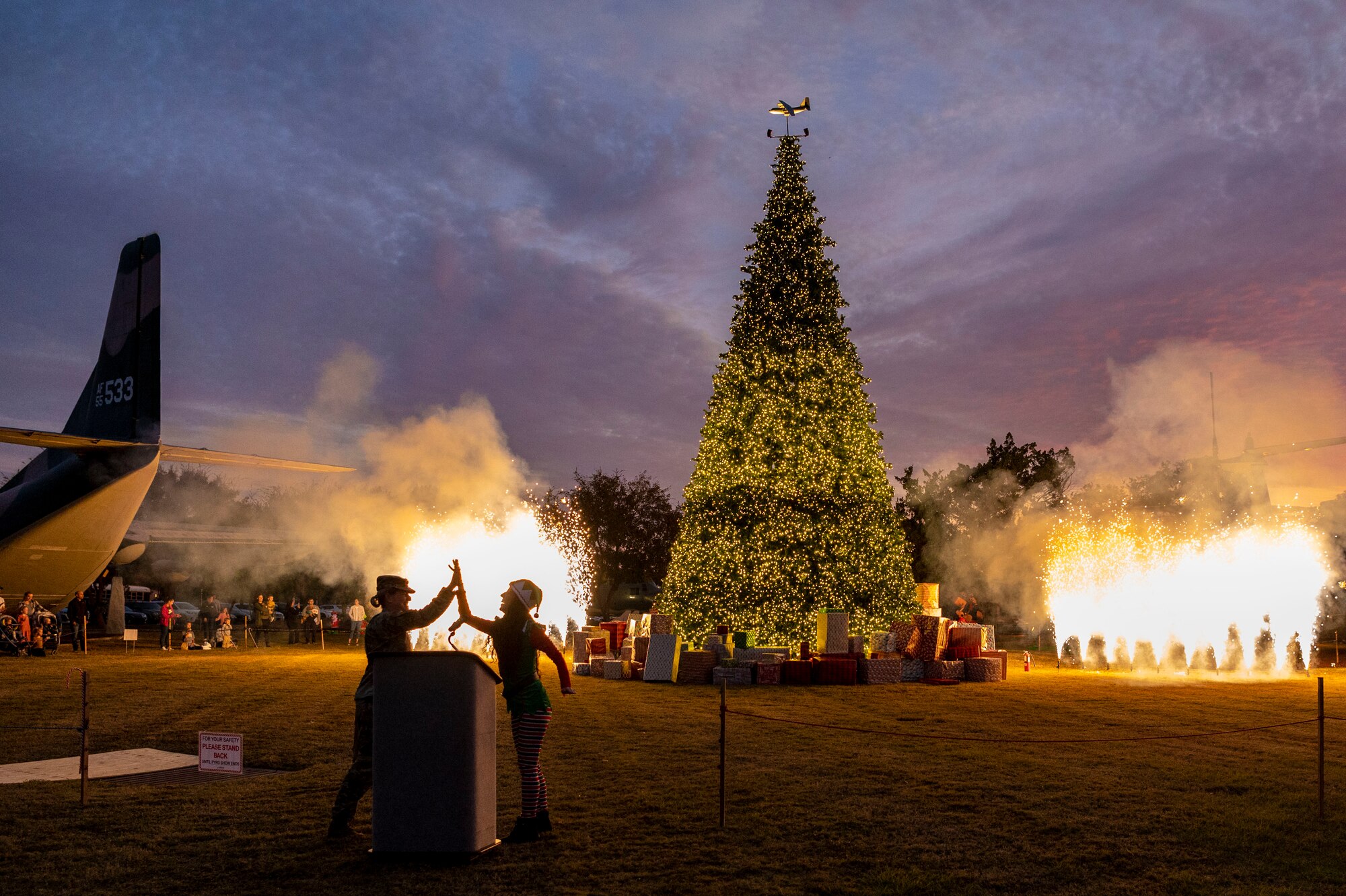 Air Commandos gather around the tree as it is lit during the annual tree lighting ceremony