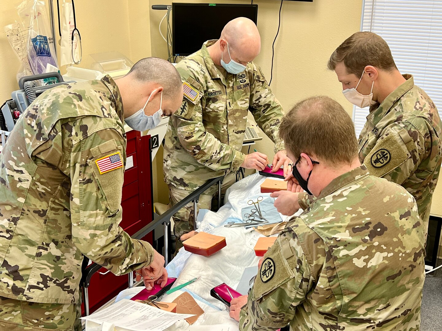 Medical providers from Bayne-Jones Army Community Hospital practice treating an abscess and cysts during the area of concentration, individual critical task list skills fair Dec. 13 at the Joint Readiness Training Center and Fort Polk, Louisiana.