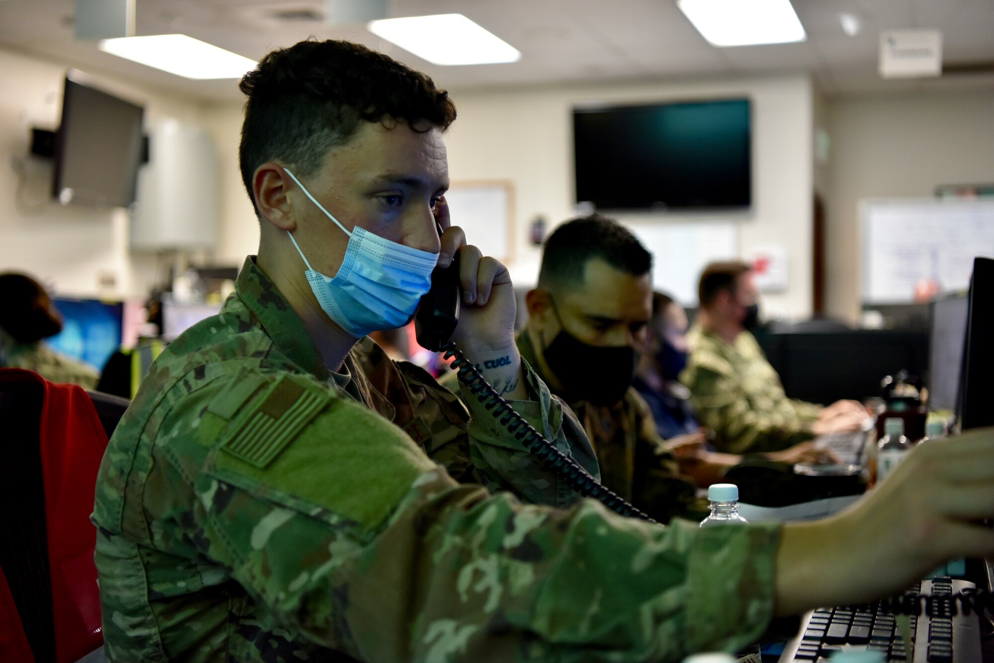 Senior Airman Jacob Thompson, Joint Base Pearl Harbor-Hickam Emergency Operations Center mass care representative, works the phones in the EOC at Joint Base Pearl Harbor-Hickam, Hawaii, Dec. 14, 2021. The Navy created the EOC to connect those impacted by the water issues to information and services provided by the Department of Defense and supporting agencies. (U.S. Air Force photo by 1st Lt. Benjamin Aronson)