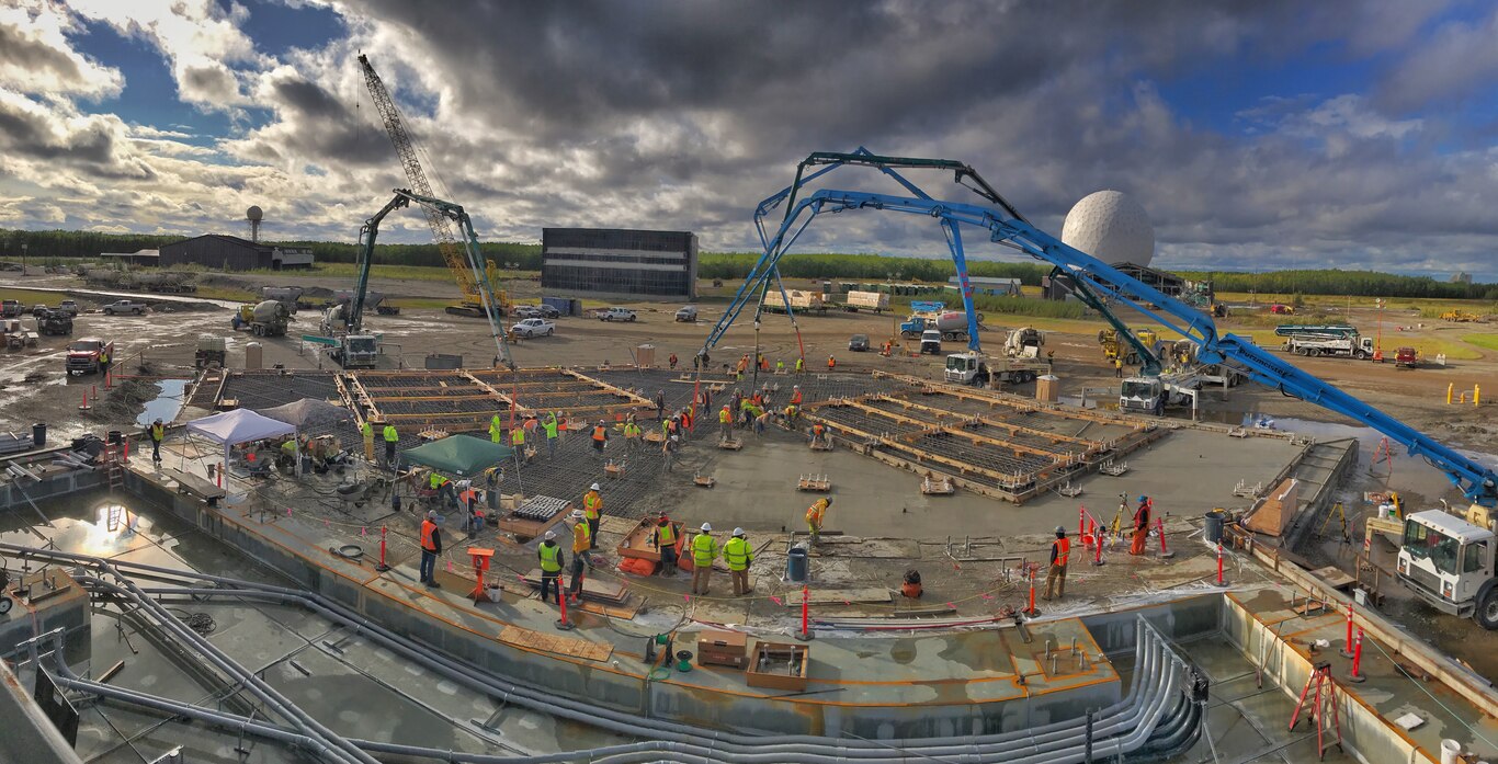 Workers pour the foundation for the mission control facility of the long range discrimination radar on Aug. 28, 2018 at Clear Space Force Station in Alaska.