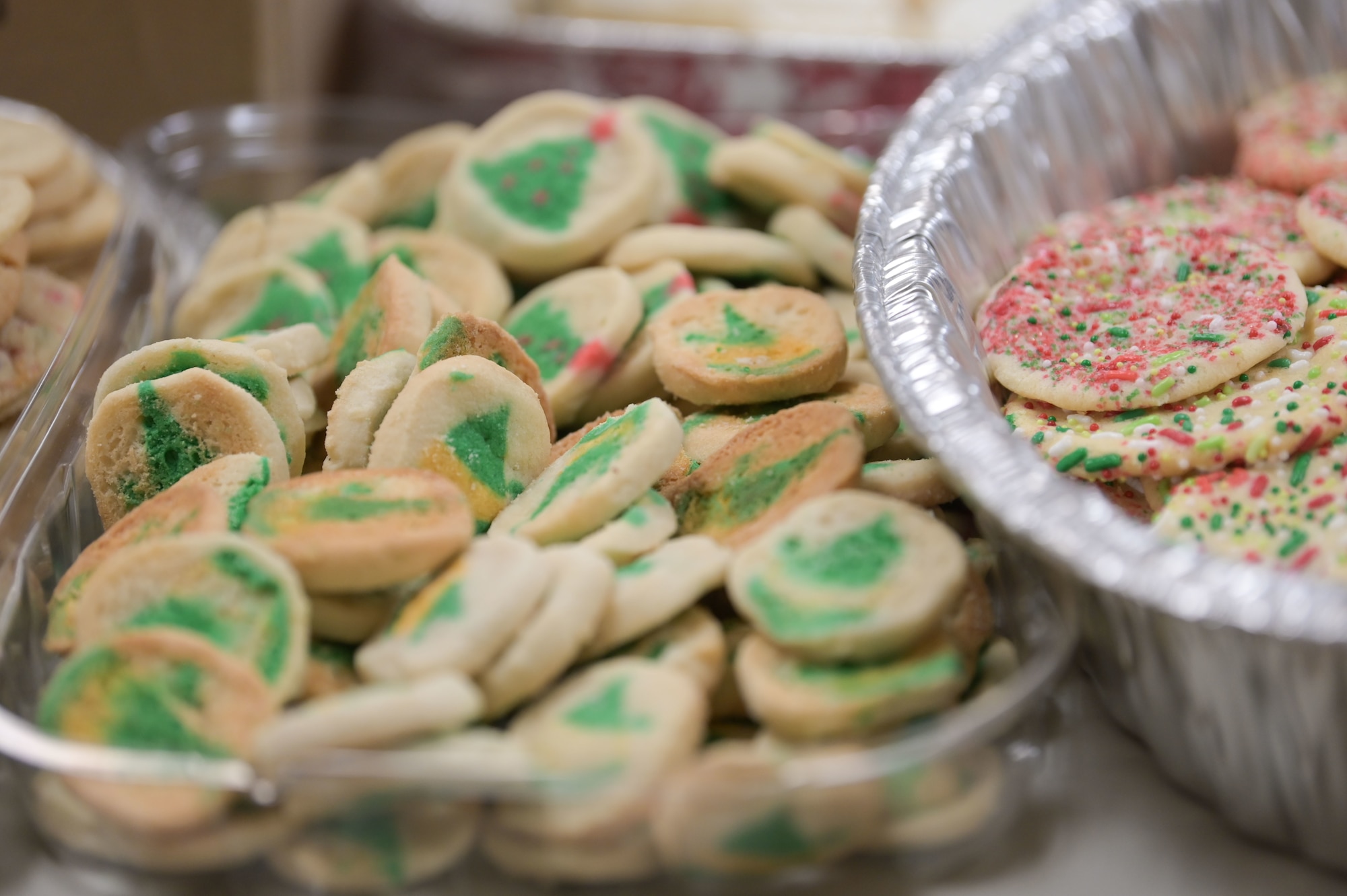 A container of donated cookies is displayed on a table as part of the Commando Cookie Drive in the Hurlburt Field Chapel