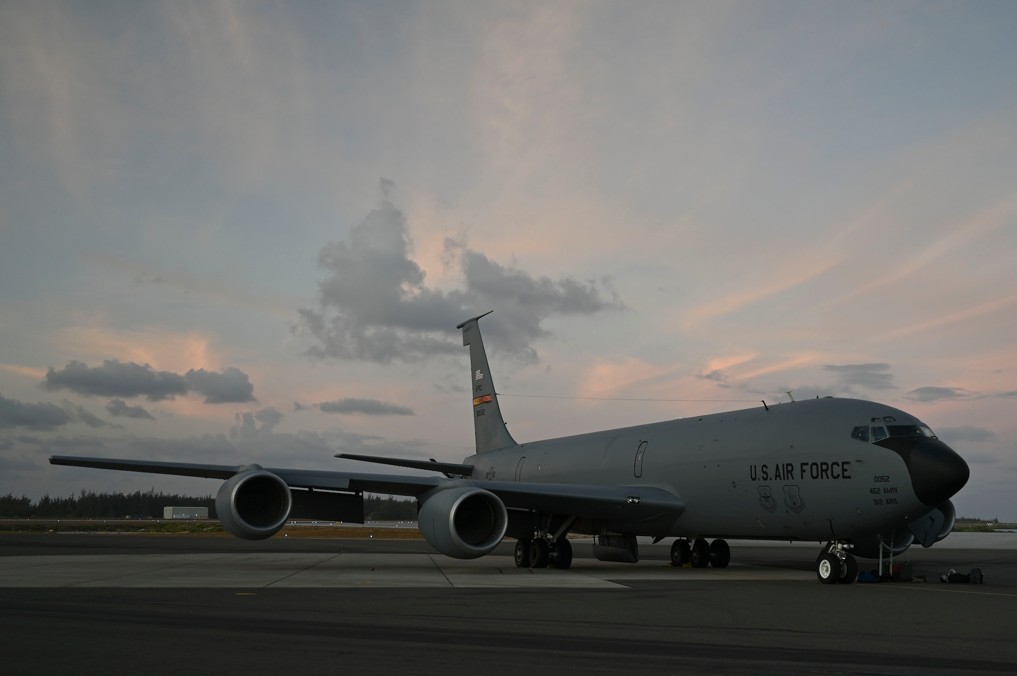 A 912th Air Refueling Squadron KC-135 from March Air Reserve Base, Calif., sits on the ramp at Wake Island Airfield awaiting the return flight to Joint Base Pearl Harbor-Hickam, Hawaii. Active duty pilots from the Air Reserve Squadron refueled A-10s en route to Wake Island Airfield and transported Special Warfare operators and mail for delivery from mainland Hawaii to the remote island as part of the AATC ACE exercise.
