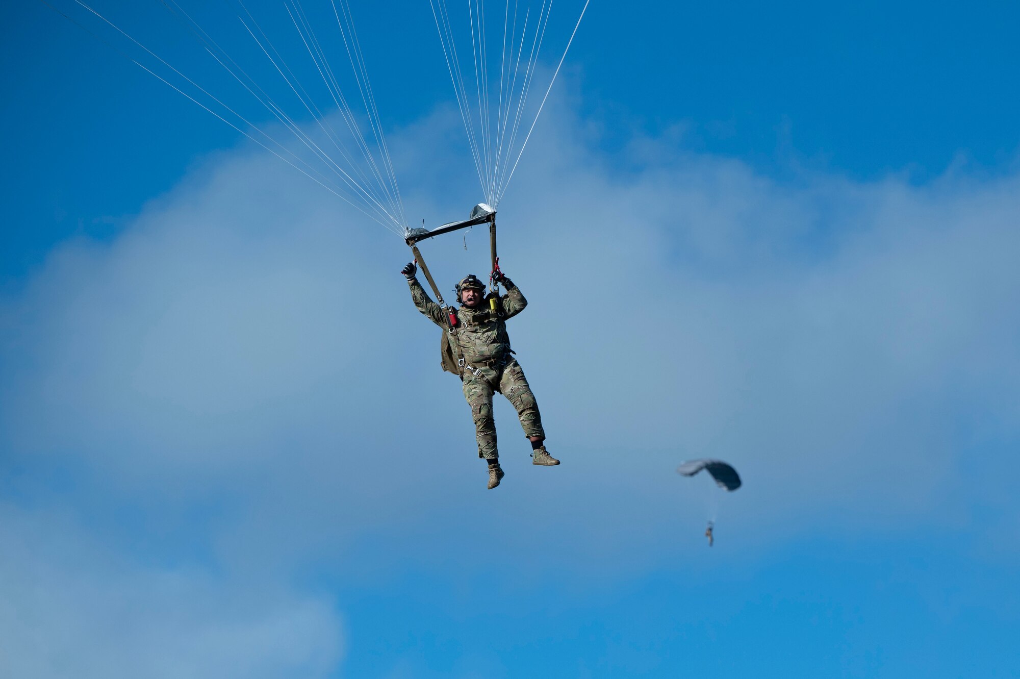 Special Warfare Airmen jump from an AATC C-130H as part of their training during Exercise KANI WILDCAT.