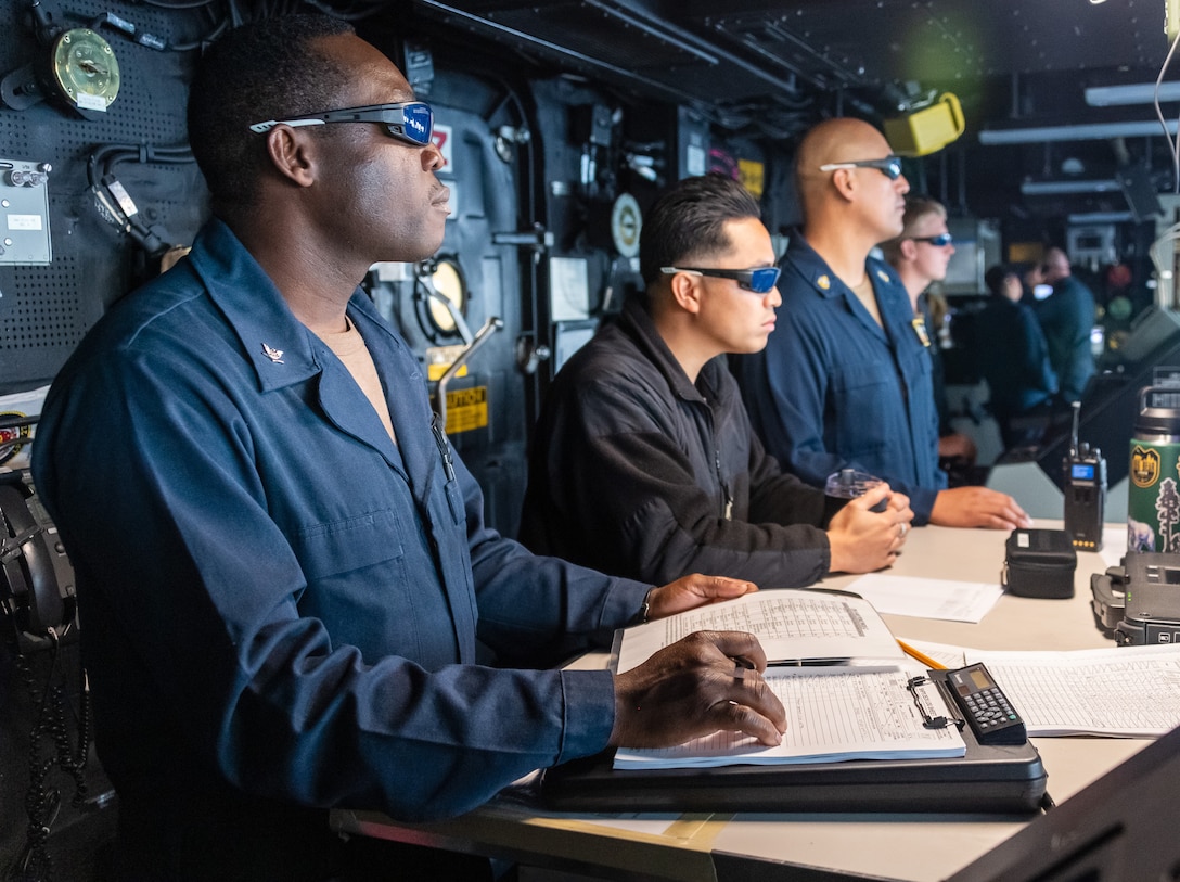 Sailors aboard Amphibious transport dock ship USS Portland (LPD 27) observe a high-energy laser weapon system demonstration on a static surface training target, Dec. 14, while sailing in the Gulf of Aden. During the demonstration, the Solid State Laser – Technology Maturation Laser Weapons System Demonstrator Mark 2 MOD 0 aboard Portland successfully engaged the training target.