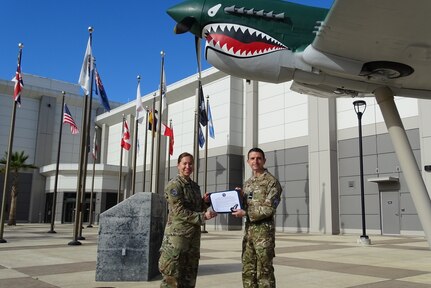 Royal Air Force Air Vice-Marshal Paul Godfrey (right), UK Space Command commander, presents U.S. Space Force Lt. Col. Michaela Schannep (left), Director of Operations for the 55th Combat Training Squadron, with a UK Space Operations Badge in recognition of Schannep’s status as a UK-qualified space instructor.
(U.S. Space Force photo by Capt. Jefferson Mitchell)