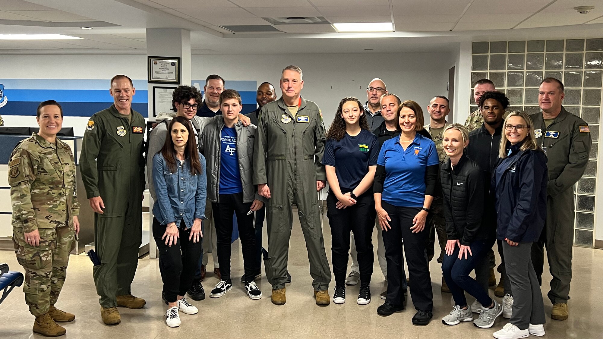 Students and administrators from the Hillsborough County School District (HCSD) pose for a photo with the command teams from Air Mobility Command, 18th Air Force and the 6th Air Refueling Wing, Dec. 9, 2021, at MacDill Air Force Base, Florida.