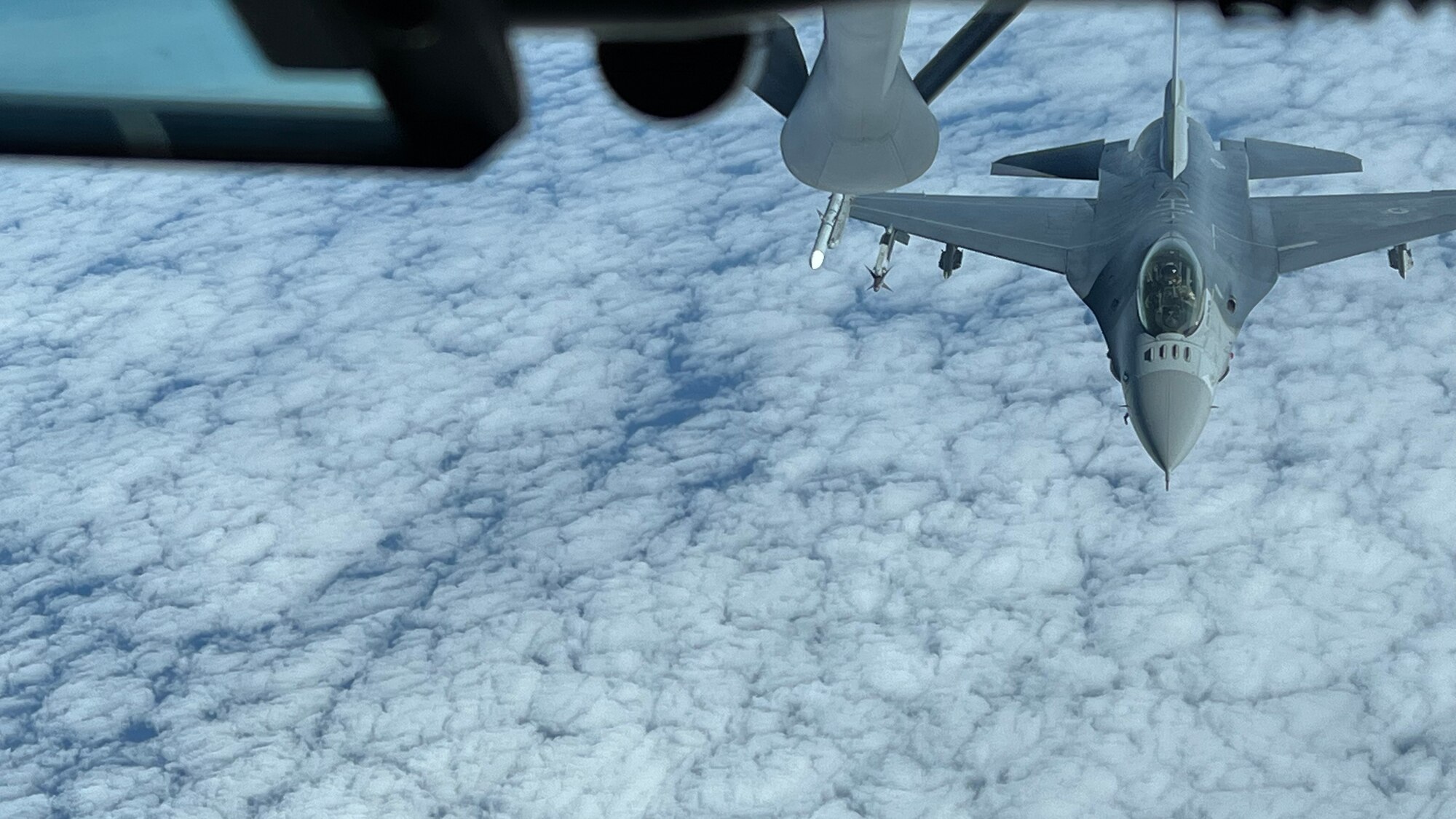 An F-16 Fighting Falcon fighter aircraft assigned to the Alabama Air National Guard’s 187th Fighter Wing approaches a KC-135 Stratotanker aircraft assigned to MacDill Air Force Base for air refueling support.