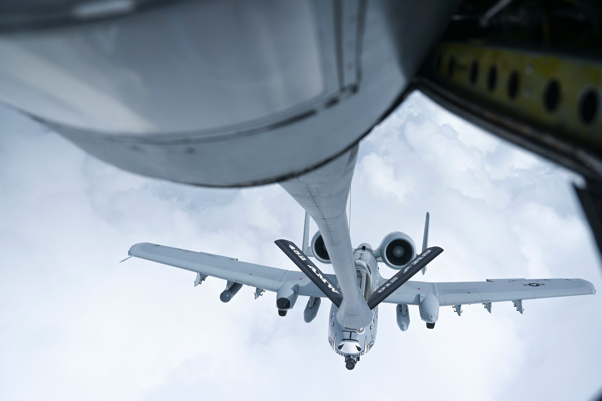An AATC A-10 from Davis-Monthan Air Force Base, Arizona, receives fuel from a California Air Reserve KC-135 en route to Wake Island Airfield from Honolulu International Airport, Hawaii, as part of Exercise KANI WILDCAT.
