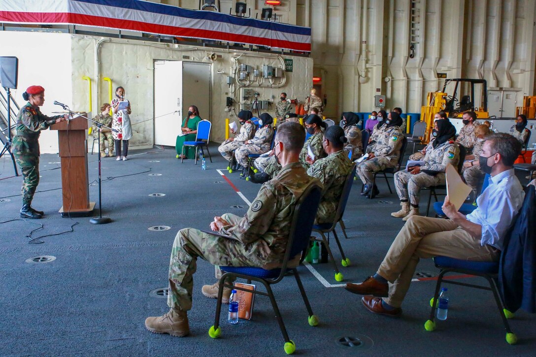 Djibouti Armed Forces Lt. Col. Amina Mohamed Moussa, commander of the Army Female Battalion, speaks to the audience during a Women, Peace, and Security event aboard the Expeditionary Sea Base USS Hershel "Woody" Williams (ESB 4), Nov. 15, 2021. The WPS program is part of a national effort to promote the meaningful contributions of women in defense and security sectors around the world. Hershel "Woody" Williams is on a scheduled deployment in the U.S. Sixth Fleet area of operations in support of U.S. national interests and security in Europe and Africa. (U.S. Marine Corps photo by Staff Sgt. Brytani Musick)