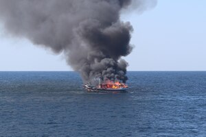 211215-N-NO146-1001
GULF OF OMAN (Dec. 15, 2021) A fire burns aboard a fishing vessel in the Gulf of Oman, Dec. 15.