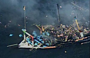 211215-N-NO146-1005
GULF OF OMAN (Dec. 15, 2021) Debris from a sinking fishing vessel in the Gulf of Oman, Dec. 15.
