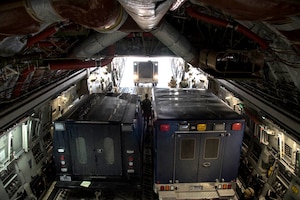 Through a “Guard Lift”mission, Airmen assigned to the 105th Airlift Wing, inspect and load a C-17 with vehicles and members from the 24th Civil Support Team (CST) from Fort Hamilton, Brooklyn. A “Guard Lift" is a requested movement of personal and supplies from one National Guard unit to another. The CST are trained to detect chemical, biological, radiological and nuclear hazards. The team departs from Puerto Rico for training out of Stewart Air National Guard Base, Newburgh N.Y. Feb. 6, 2021. (U.S. Air Force photo by Senior Airman Mary Schwarzler)