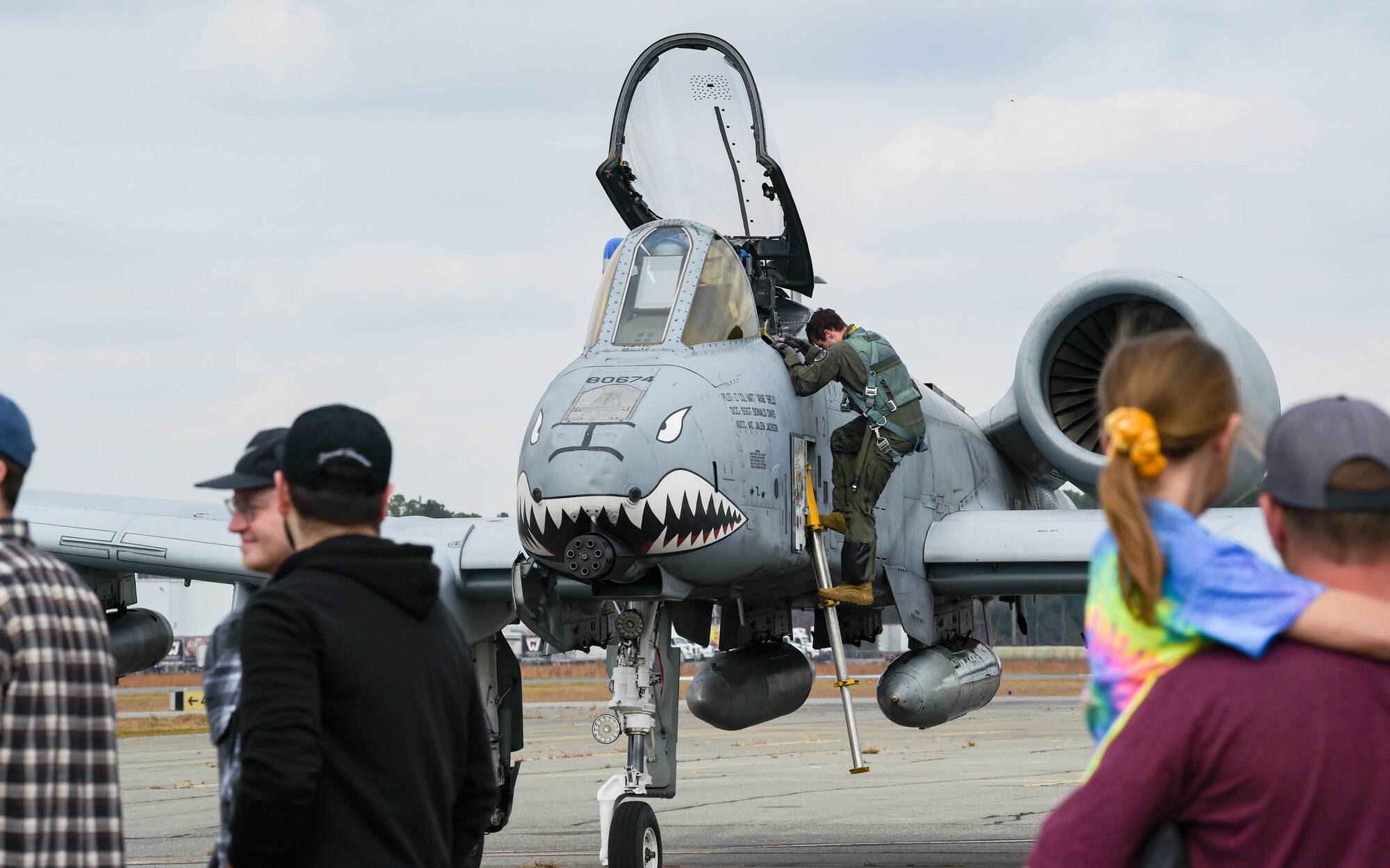 U.S. Air Force Capt. Matt Dorsey, 74th Fighter Squadron A-10C Thunderbolt II pilot, dismounts an A-10C during a WWII living history event at Douglas, Georgia, Dec. 4, 2021. The living history event at the 63rd Flight Training Squadron used during WWII. (U.S. Air Force photo by Senior Airman Rebeckah Medeiros)