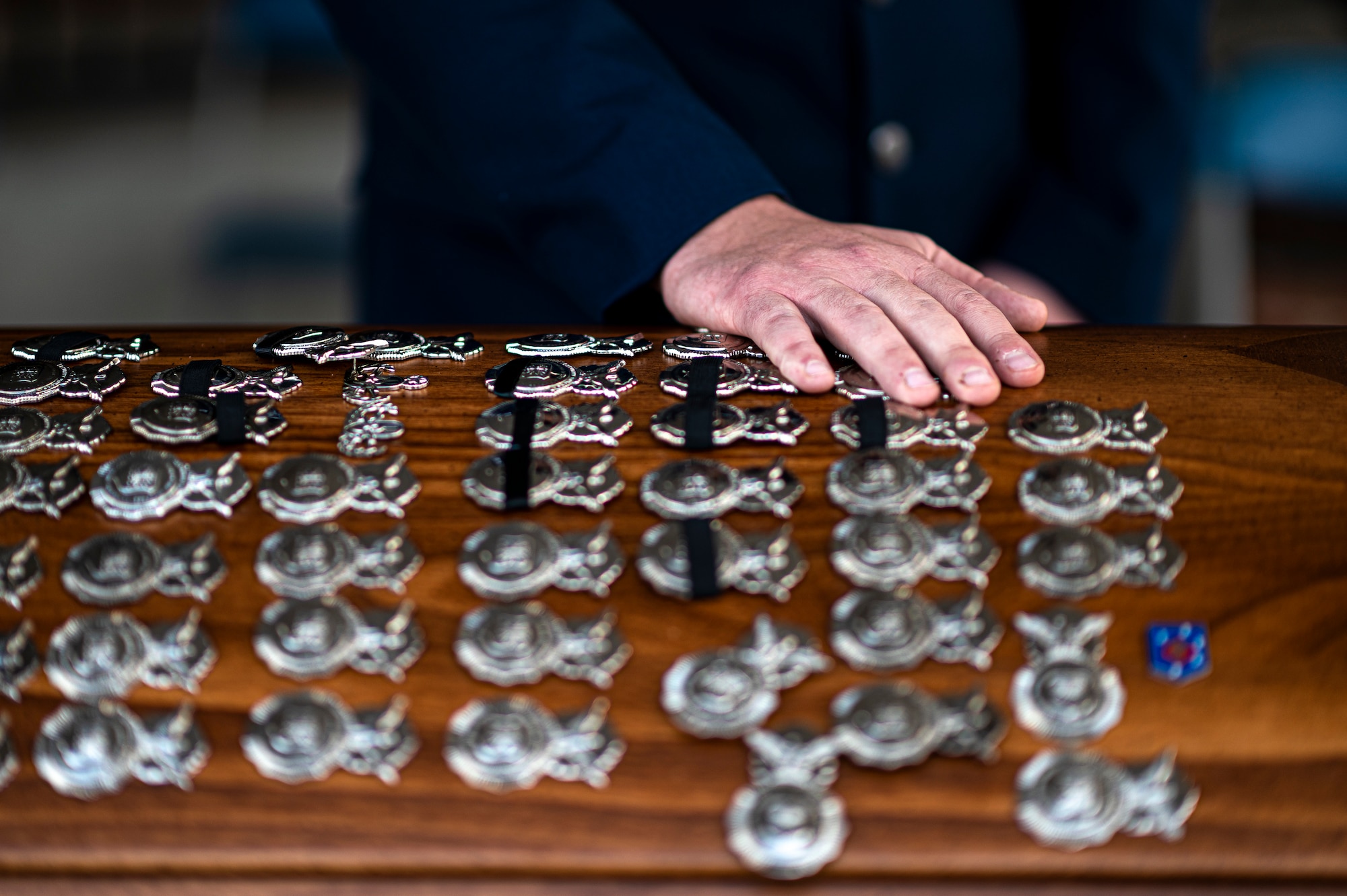 Photo of an Airman's hand on top of a casket