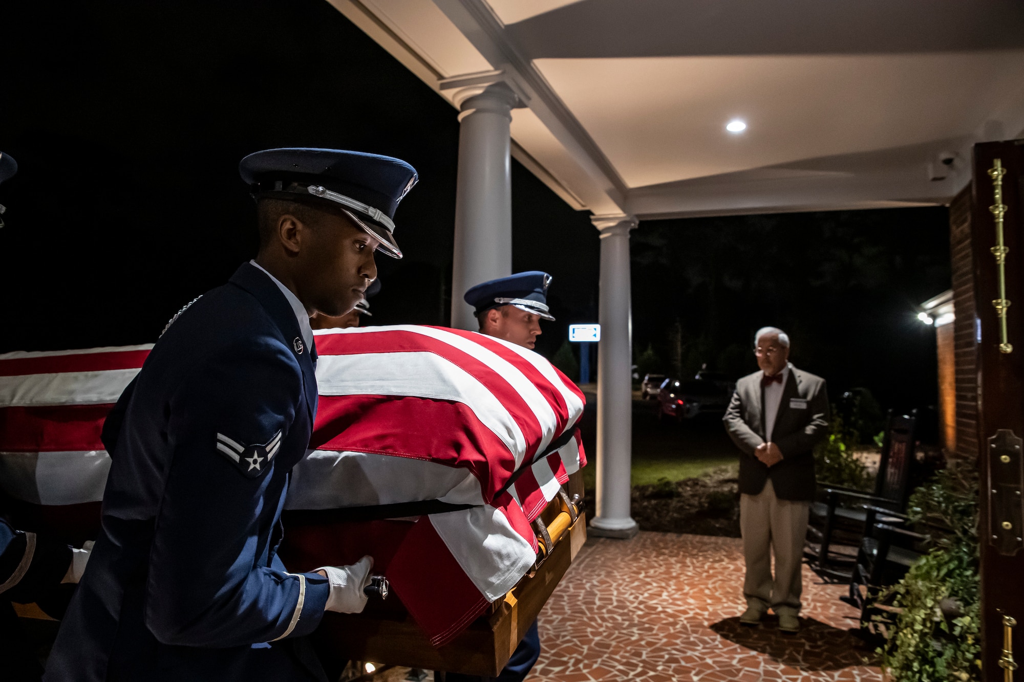 Photo of Airmen carrying a casket