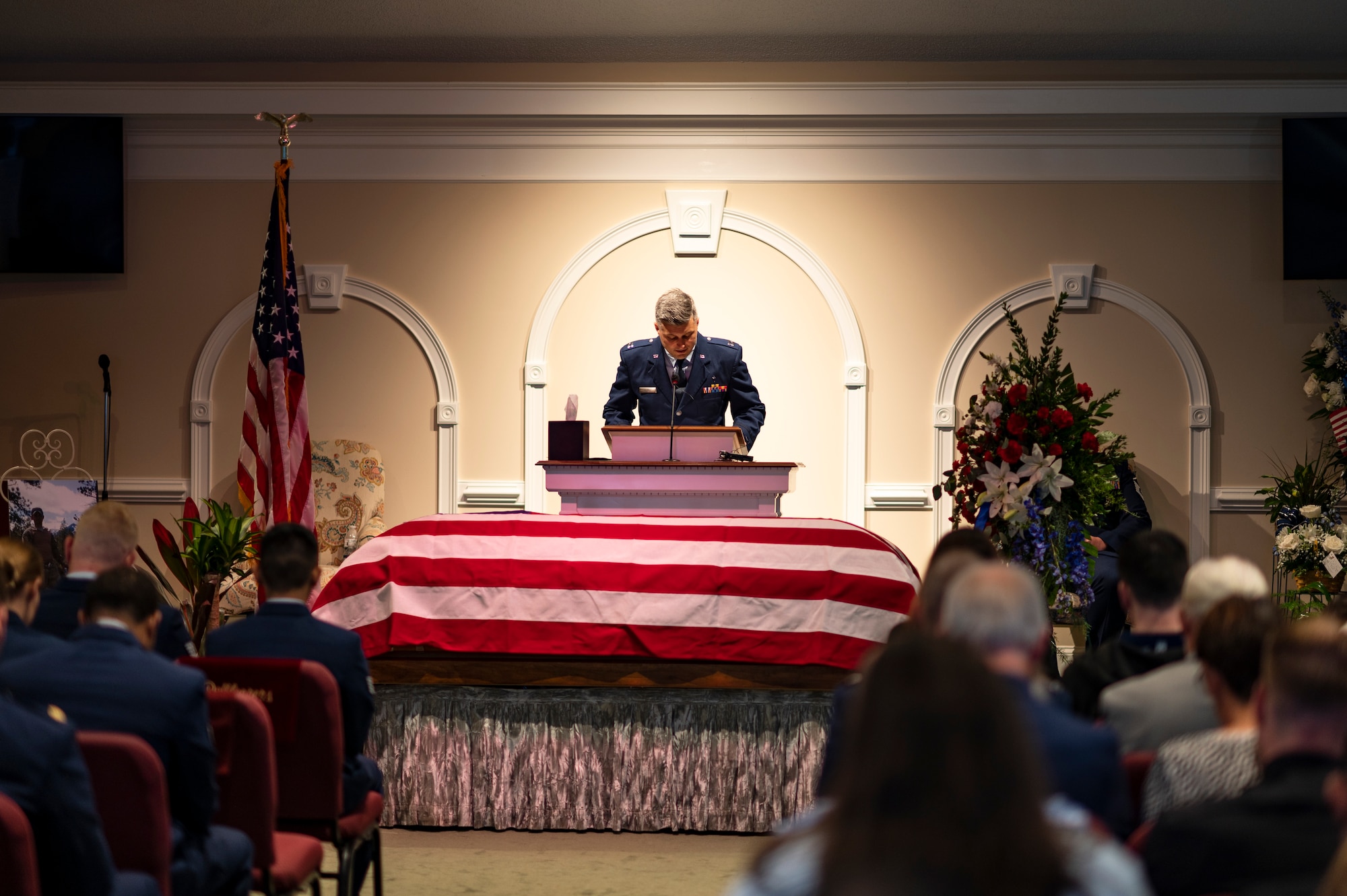 Photo of Airman talking at a podium