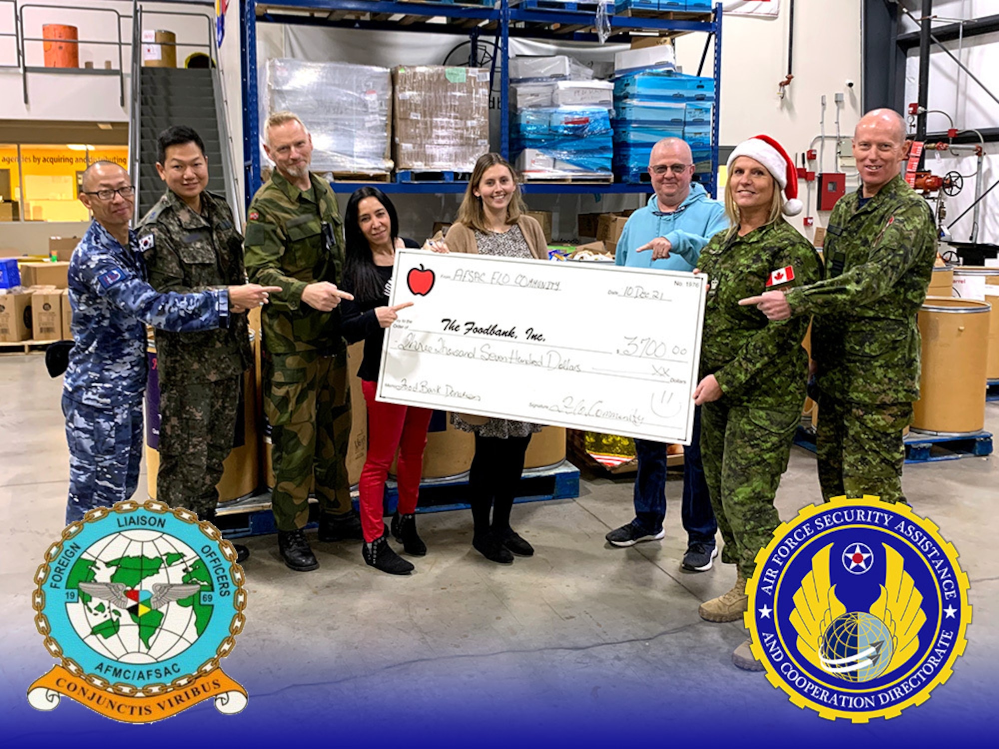 AFSAC representatives and international partners from Australia, Canada, Norway, and South Korea were able to be present for a donation to the Dayton Foodbank. Not in picture is more than 15 other countries’ FLOs who participated in the community service initiative (Graphic: Jonathan Tharp).