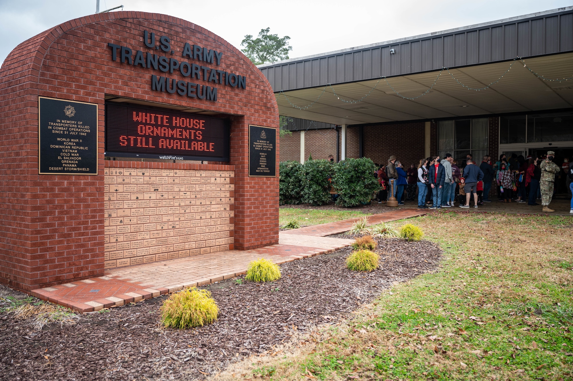 Members of the JBLE community line up at the U.S. Army Transportation Museum for Operation Sgt. Santa at Joint Base Langley-Eustis, Virginia, Dec. 11, 2021.