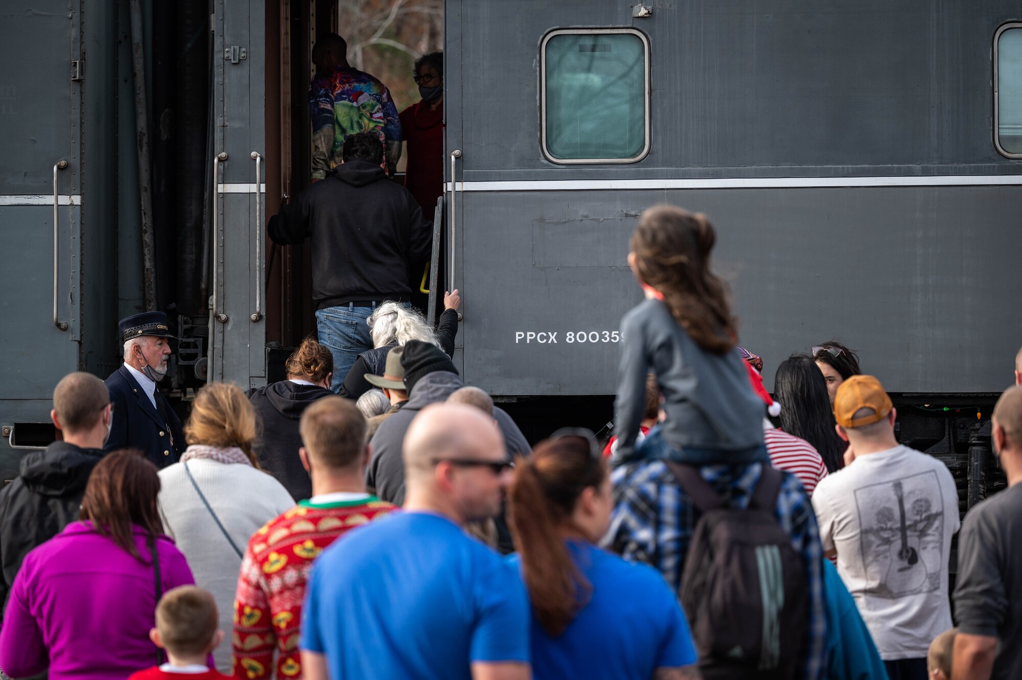 Members of the JBLE community board a train for Operation Sgt. Santa at Joint Base Langley-Eustis, Virginia, Dec. 11, 2021.