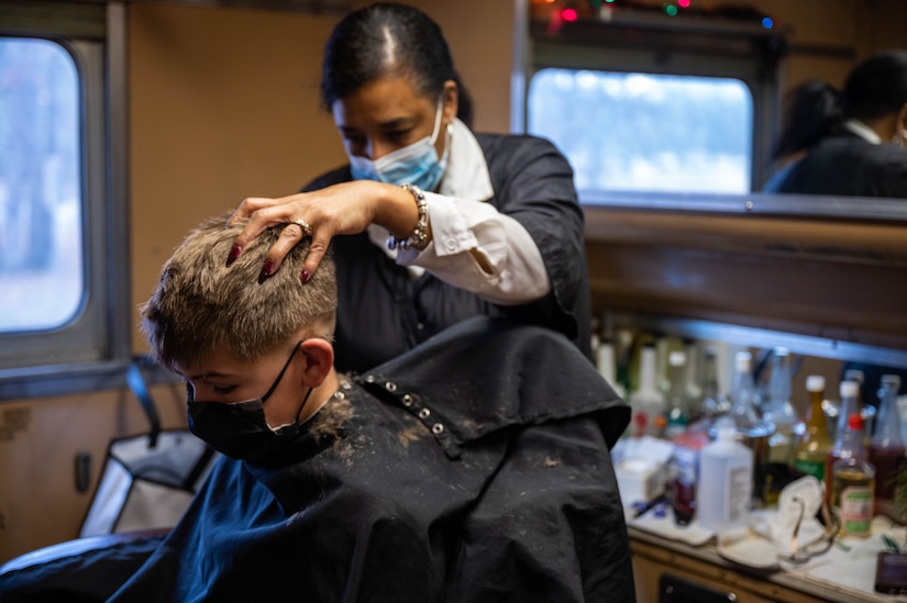 The Army & Air Force Exchange Service offered free barber services throughout the train rides during Operation Sgt. Santa at Joint Base Langley-Eustis, Virginia, Dec. 11, 2021.