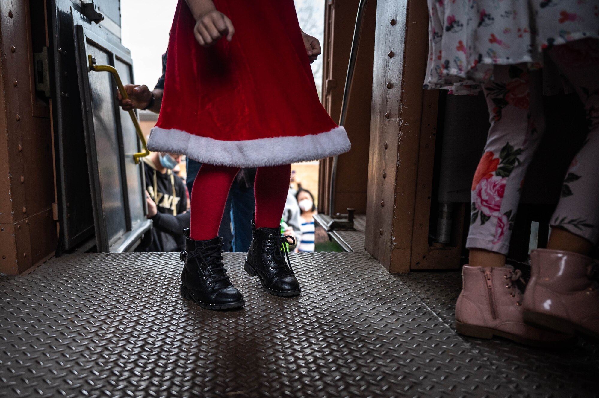 Members of the JBLE community board a train for Operation Sgt. Santa at Joint Base Langley-Eustis, Virginia, Dec. 11, 2021.