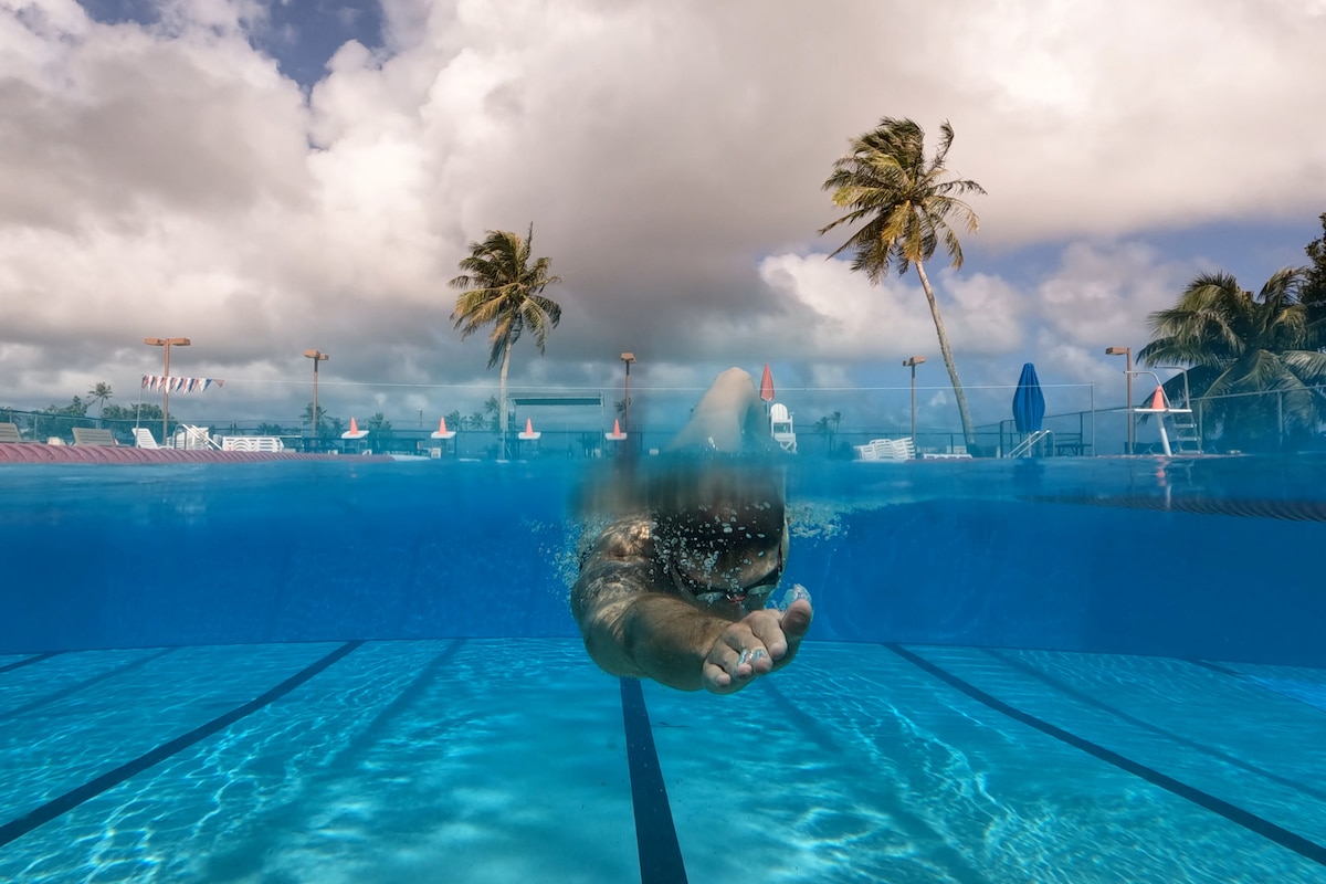 A sailor swims in a pool.