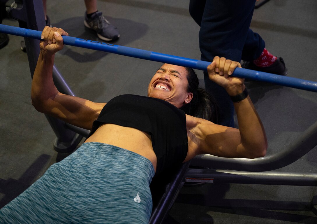 Shanika Tophia, 88th Medical Support Squadron, takes her first attempt in the bench press portion of the powerlifting competition in the Wright Field Fitness Center Dec. 11, 2020, at Wright-Patterson Air Force Base. Tophia powered her way to a
second-place finish in the event. (U.S. Air Force photo by R.J. Oriez)