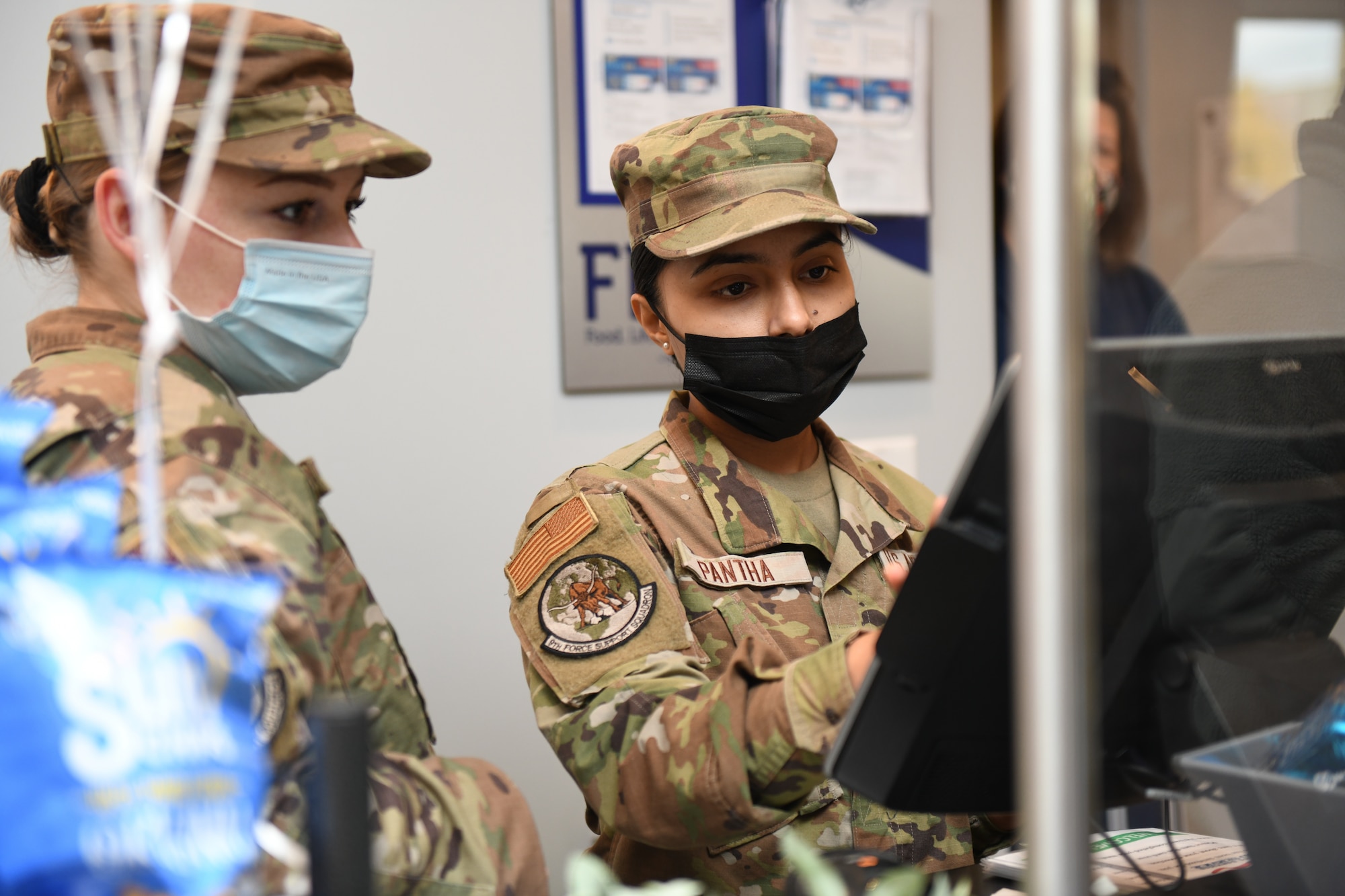 9th Force Support Squadron Airmen ring up a customer at the new Dragon’s Lair Dec. 15, 2021 at Beale Air Force Base, California.