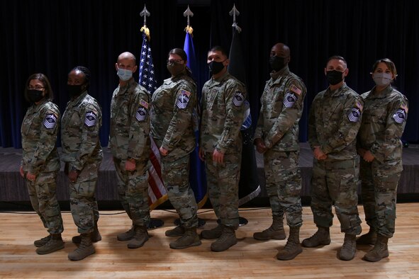 The newest Front Range U.S. Space Force senior master sergeant selects pose for a photo during the Peterson Space Force Base, Schriever SFB and Cheyenne Mountain Space Force Station Release Party at Peterson SFB, Colorado, Dec. 14, 2021. (U.S. Space Force photo by Airman 1st Class Aaron Edwards)