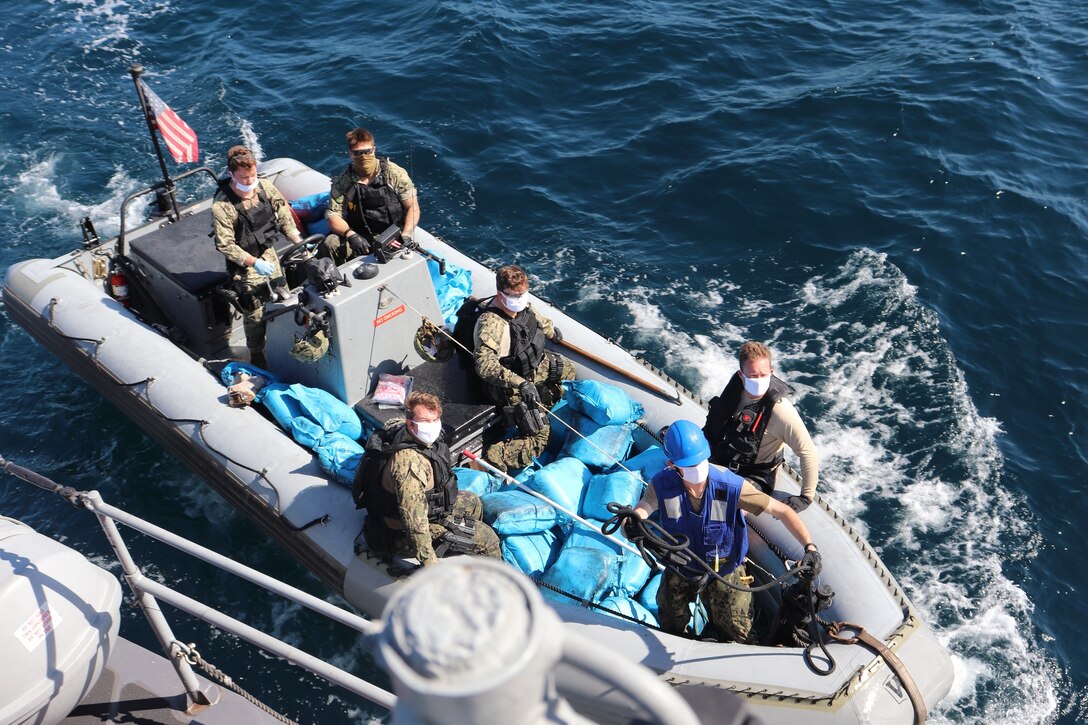 211215-N-NO146-1006
GULF OF OMAN (Dec. 15, 2021) U.S. Sailors assigned to coastal patrol ship USS Sirocco (PC 6) transport illicit drugs seized from a fishing vessel in the Gulf of Oman, Dec. 15.