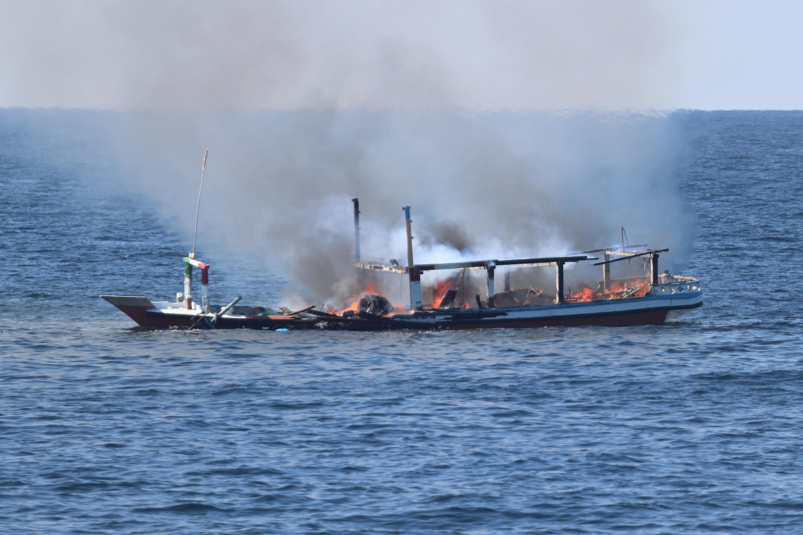 211215-N-NO146-1002
GULF OF OMAN (Dec. 15, 2021) A fire burns aboard a fishing vessel in the Gulf of Oman, Dec. 15.