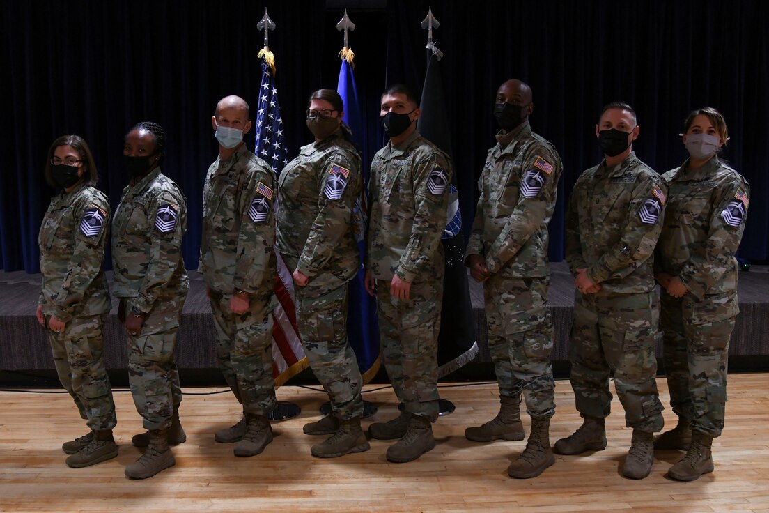 The newest Front Range U.S. Space Force senior master sergeant selects pose for a photo during the Peterson Space Force Base, Schriever SFB and Cheyenne Mountain Space Force Station Release Party at Peterson SFB, Colorado, Dec. 14, 2021. (U.S. Space Force photo by Airman 1st Class Aaron Edwards)