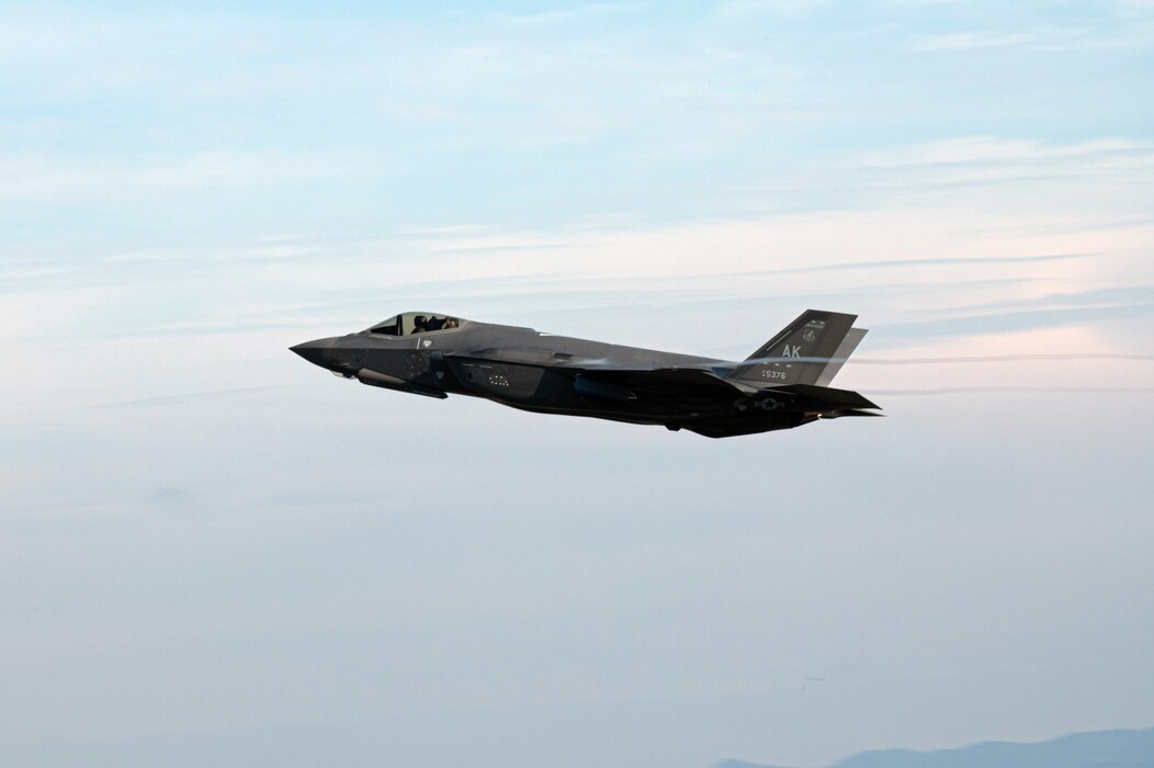 An F-35A Lightning II flies over Marine Corps Air Station Iwakuni, Japan