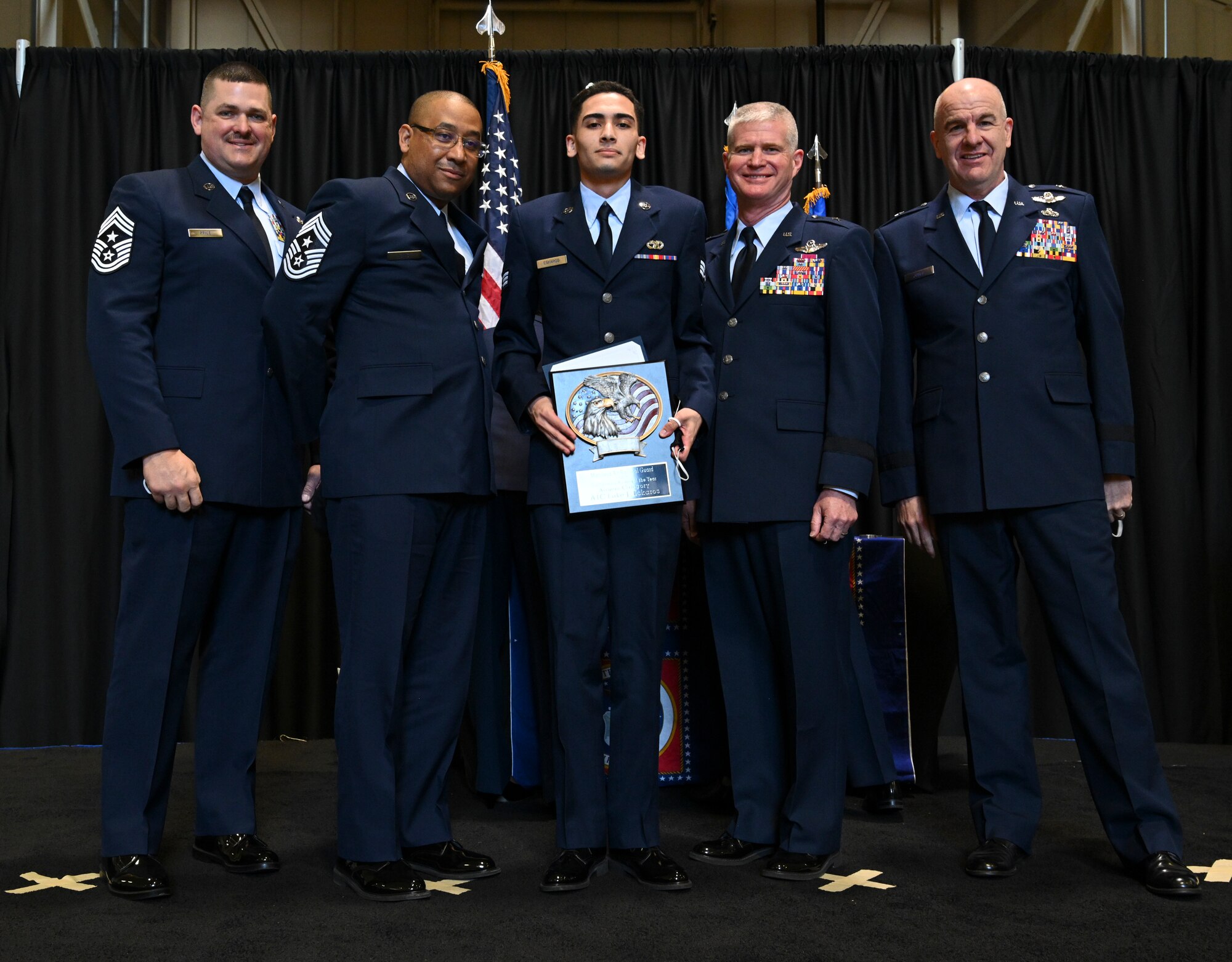 U.S. Air Force Tech. Sgt. Matthew Harbin, 175th Wing Noncommissioned officer of the Year, Maryland Air National Guard, receives a plaque at Warfield Air National Guard Base, Middle River, Md., during the 2021 Airman Recognition Ceremony. The yearly event pays tribute to the outstanding achievements of the Maryland Air National Guard and names the wing's outstanding Airman of the year. (U.S. Air National Guard photo by Amn Alexandra Huettner)