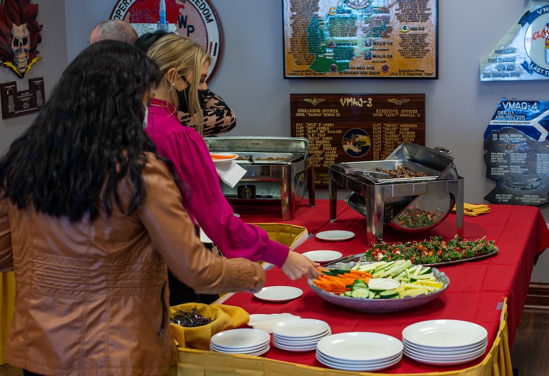 Members from the local media grab food after a press event thanking the community for the 2021 MCAS Cherry Point Air Show and 80th Anniversary Celebration, at Marine Corps Air Station (MCAS) Cherry Point, North Carolina, Dec. 15, 2021. The installation was awarded three separate awards for the show. Without the help from the surrounding community, the air show wouldn’t have happened. (U.S. Marine Corps Photo by Lance Cpl. Jacob Bertram)