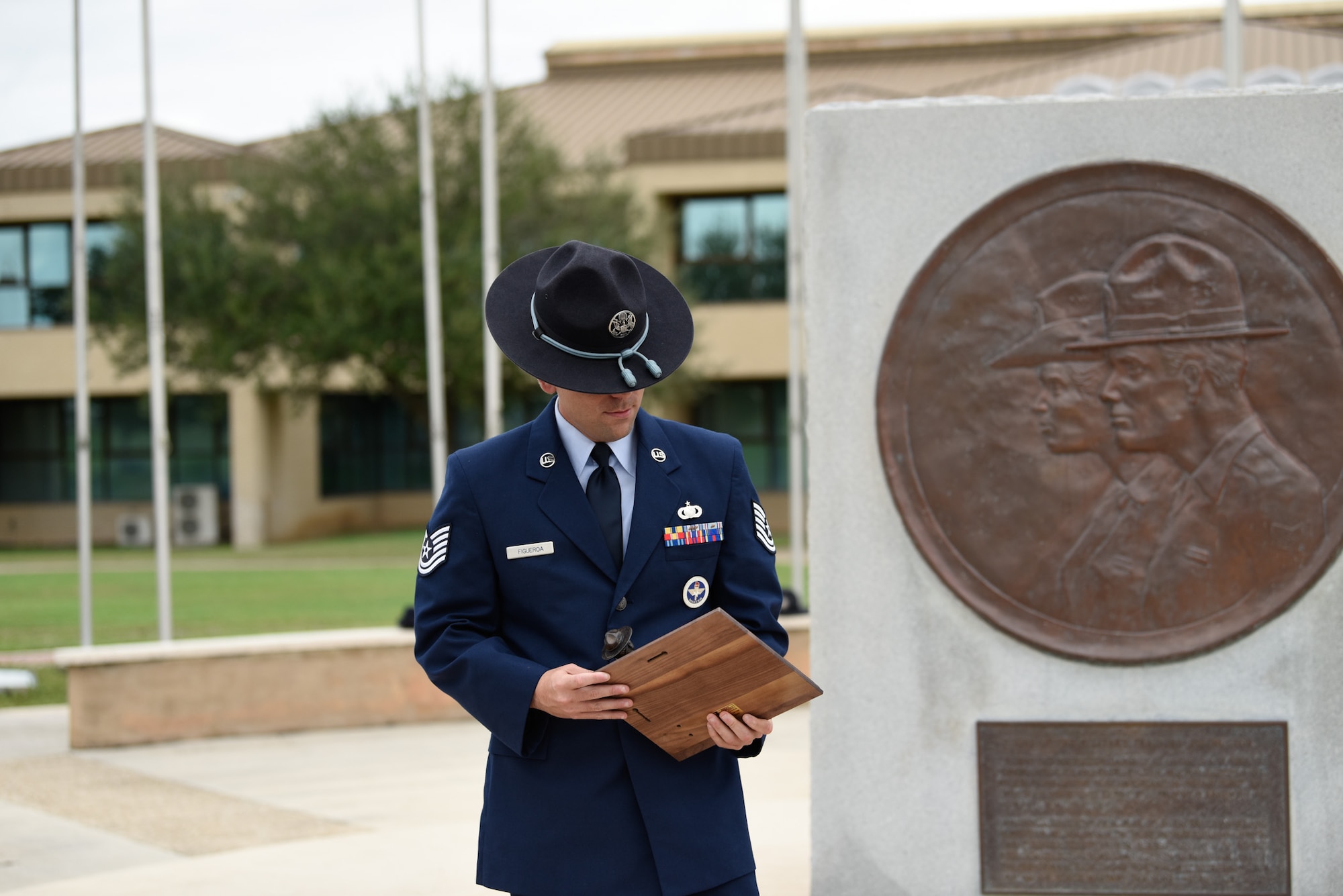 TSgt Figueroa looks at his Blue Rope of the Year plaque