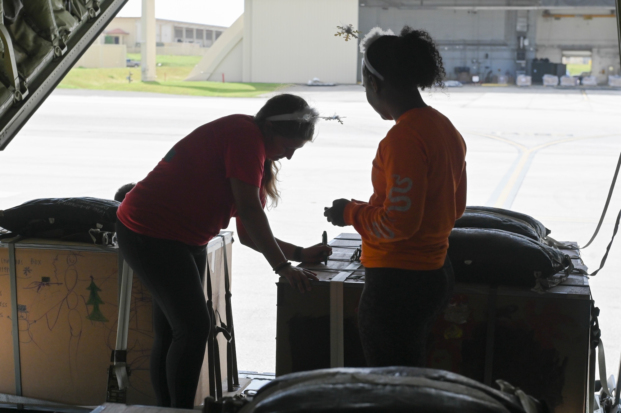 A person signing a package.