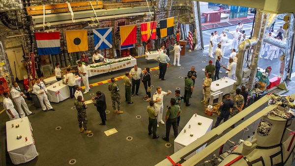 DILI, Timor-Leste (Dec. 8, 2021) Sailors aboard Independence-variant littoral combat ship USS Charleston (LCS 18) host a reception in the hangar bay during a scheduled port visit to Dili, Timor-Leste. Charleston, part of Destroyer Squadron (DESRON) 7, is on a rotational deployment in the U.S. 7th Fleet area of operation to enhance interoperability with partners and serve as a ready-response force in support of a free and open Indo-Pacific region. (U.S. Navy photo by Mass Communication Specialist 2nd Class Ryan M. Breeden)