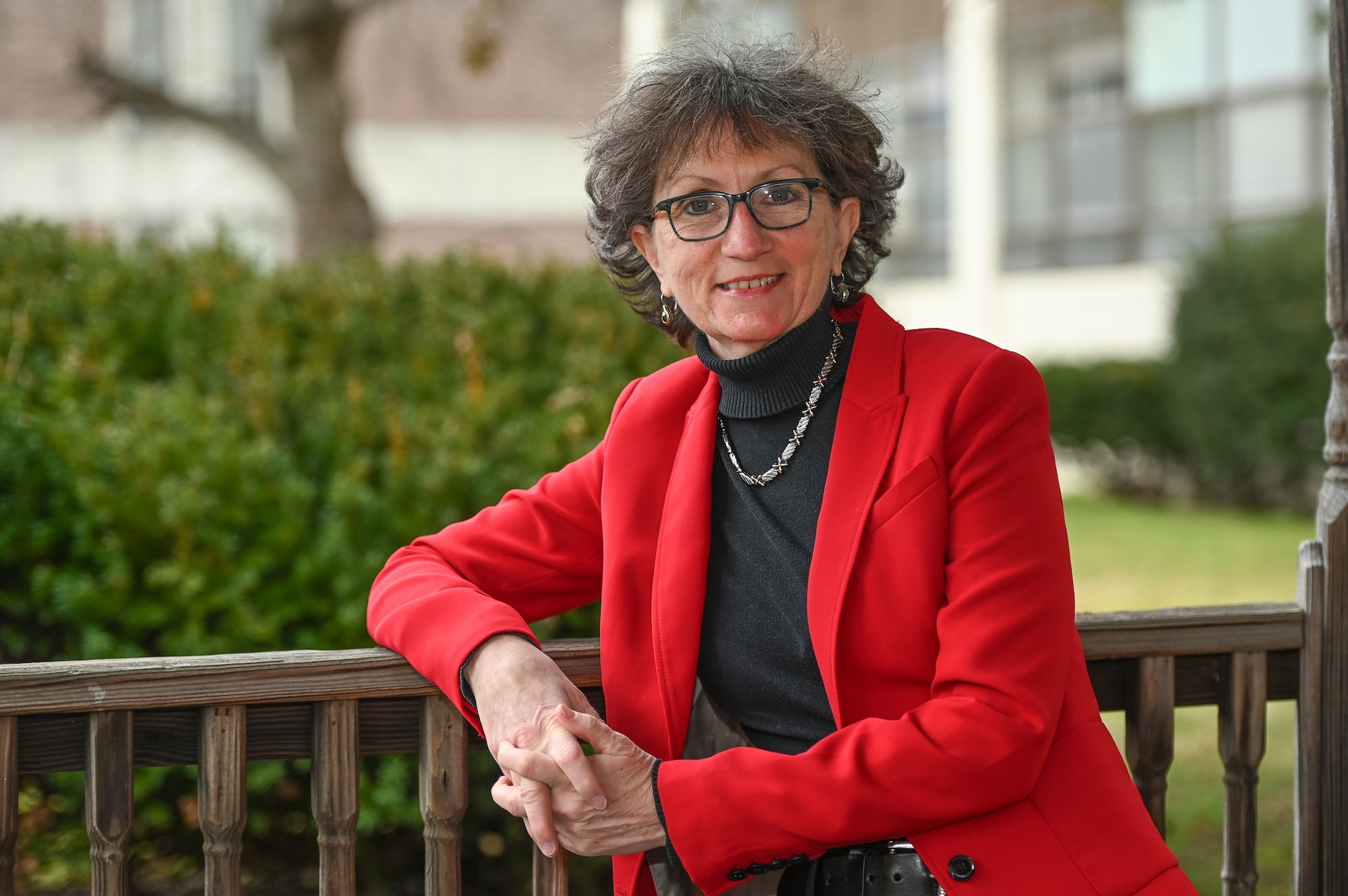 Kathy Owens, Hanscom's Civilian Personnel officer, sits for a portrait outside the Conference Center at Hanscom Air Force Base, Mass., Dec. 13. Owens will retire this month after 37 years of civil service. (U.S. Air Force photo by Mark Herlihy)