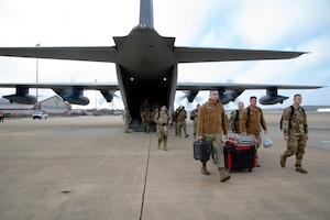 Photo of U.S. Air Force Airmen from the 23d Wing, Moody Air Force Base, deplane at Joint Base Langley-Eustis, Virginia