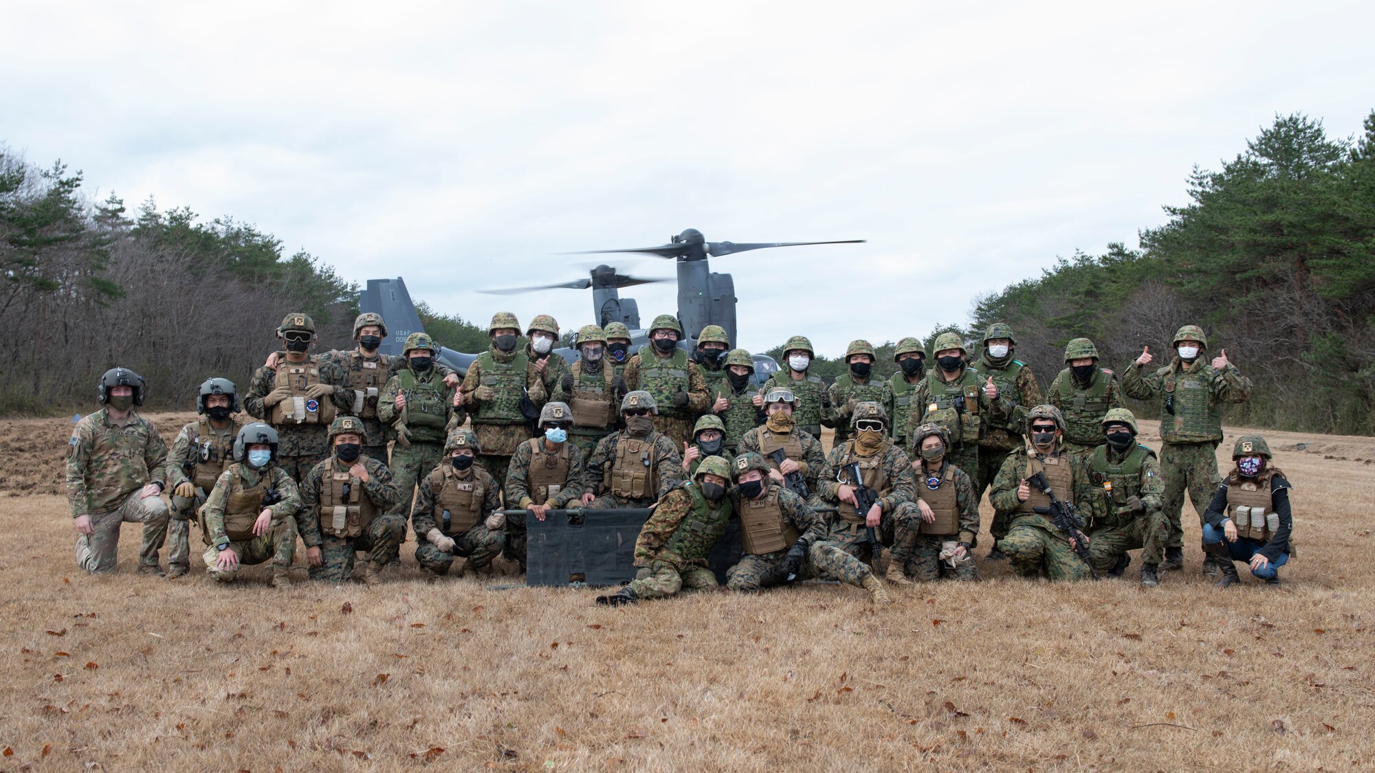 A large group photo of U.S. marines and Japanese soldiers.