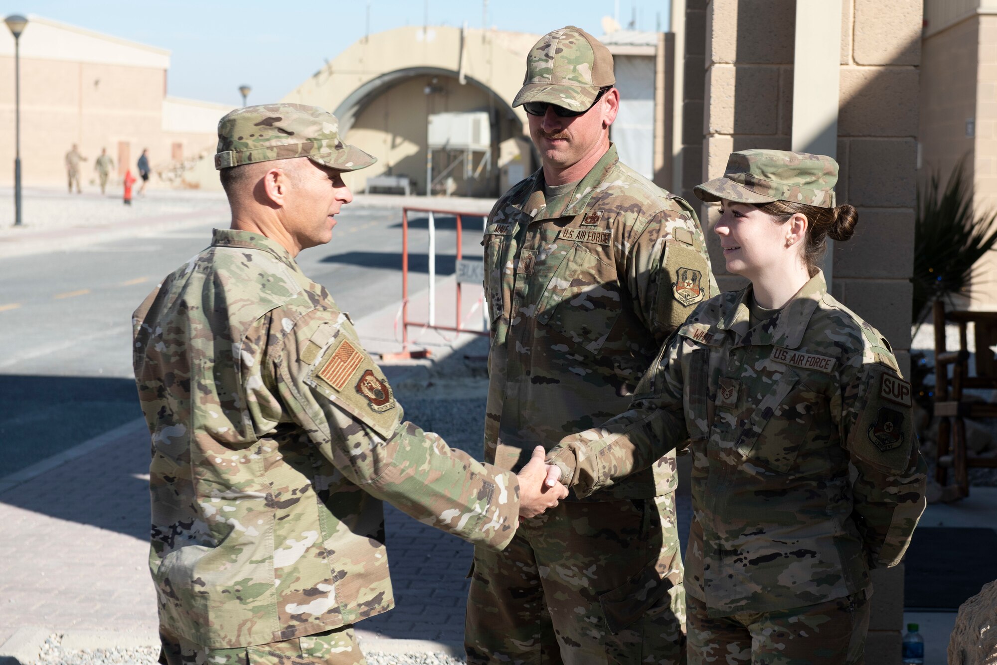 Two Airman shake hands