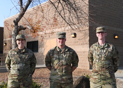 From left, California Air National Guard Senior Airman Valerie Malcom and Airmen 1st Class Cody Schlenzig and Joshua Lloyd, 144th Fighter Wing, at the Fresno Air National Guard Base, Calif., Dec. 4, 2021. The Airmen volunteered to participate in Operation Allies Welcome, assisting evacuated Afghan refugees at Joint Base McGuire-Dix-Lakehurst, New Jersey.