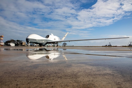 An MQ-4C Triton Unmanned Aircraft System (UAS), assigned to Unmanned Patrol Squadron 19 (VUP-19), sits on the flight line