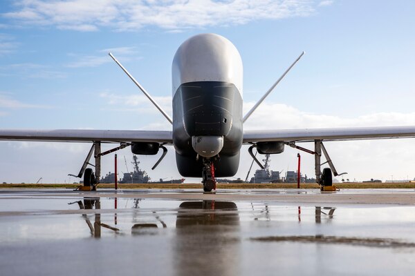 An MQ-4C Triton Unmanned Aircraft System (UAS), assigned to Unmanned Patrol Squadron 19 (VUP-19), sits on the flight line