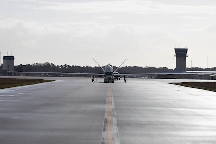 An MQ-4C Triton Unmanned Aircraft System (UAS), assigned to Unmanned Patrol Squadron 19 (VUP-19), taxis across the flight line